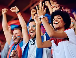 fans cheering at a sports game